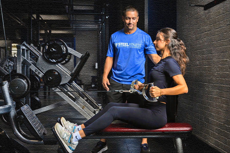 Personal trainer working with a client at Steel Fitness Riverport