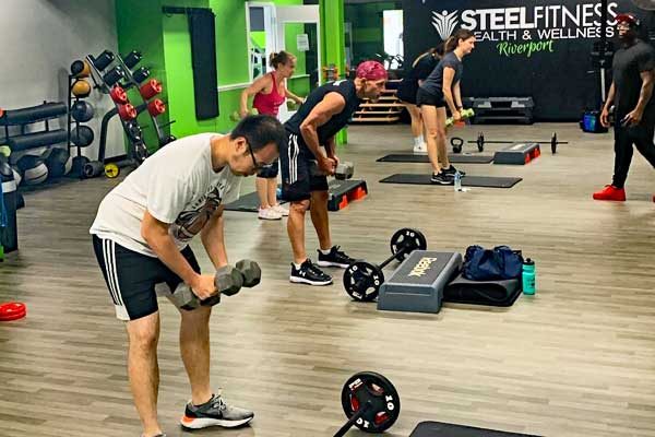 exercise class using weights in the exercise studio at steel fitness riverport in bethlehem pa